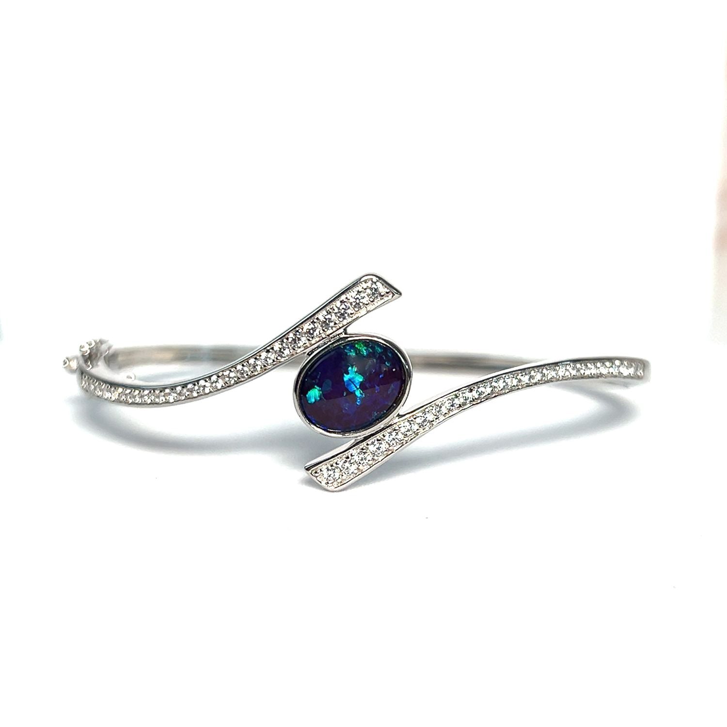 Sterling Silver cross over snap bangle with Opal triplet and cz