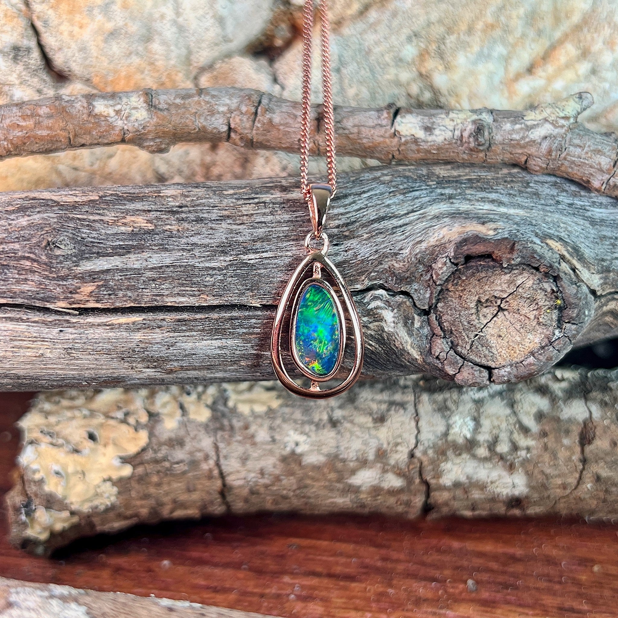 freeform Australian opal doublet pendant in rose gold-plated silver, blue, green and red play-of-colour