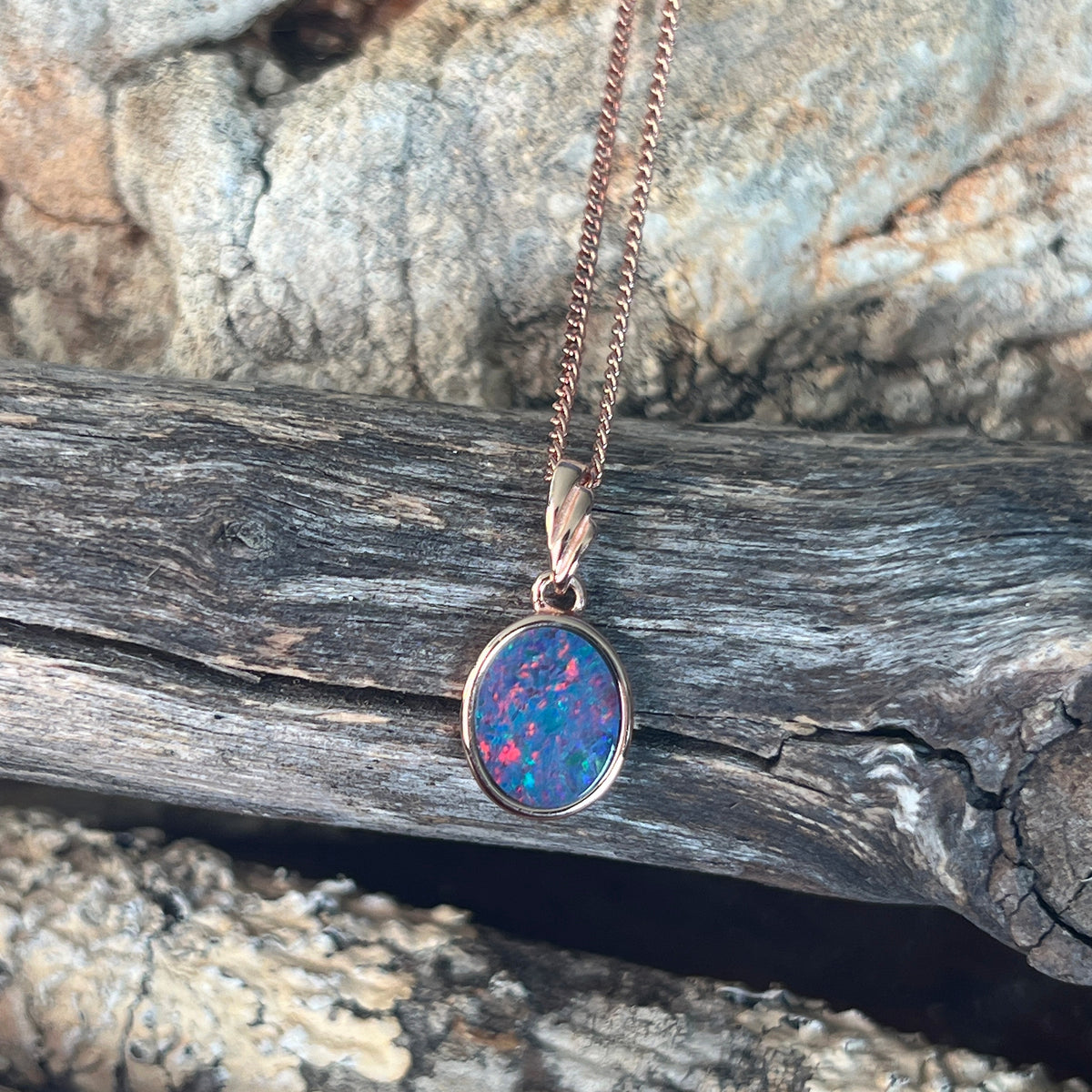15 x 7.5mm Australian opal doublet pendant in rose gold-plated silver, red, blue, green and violet