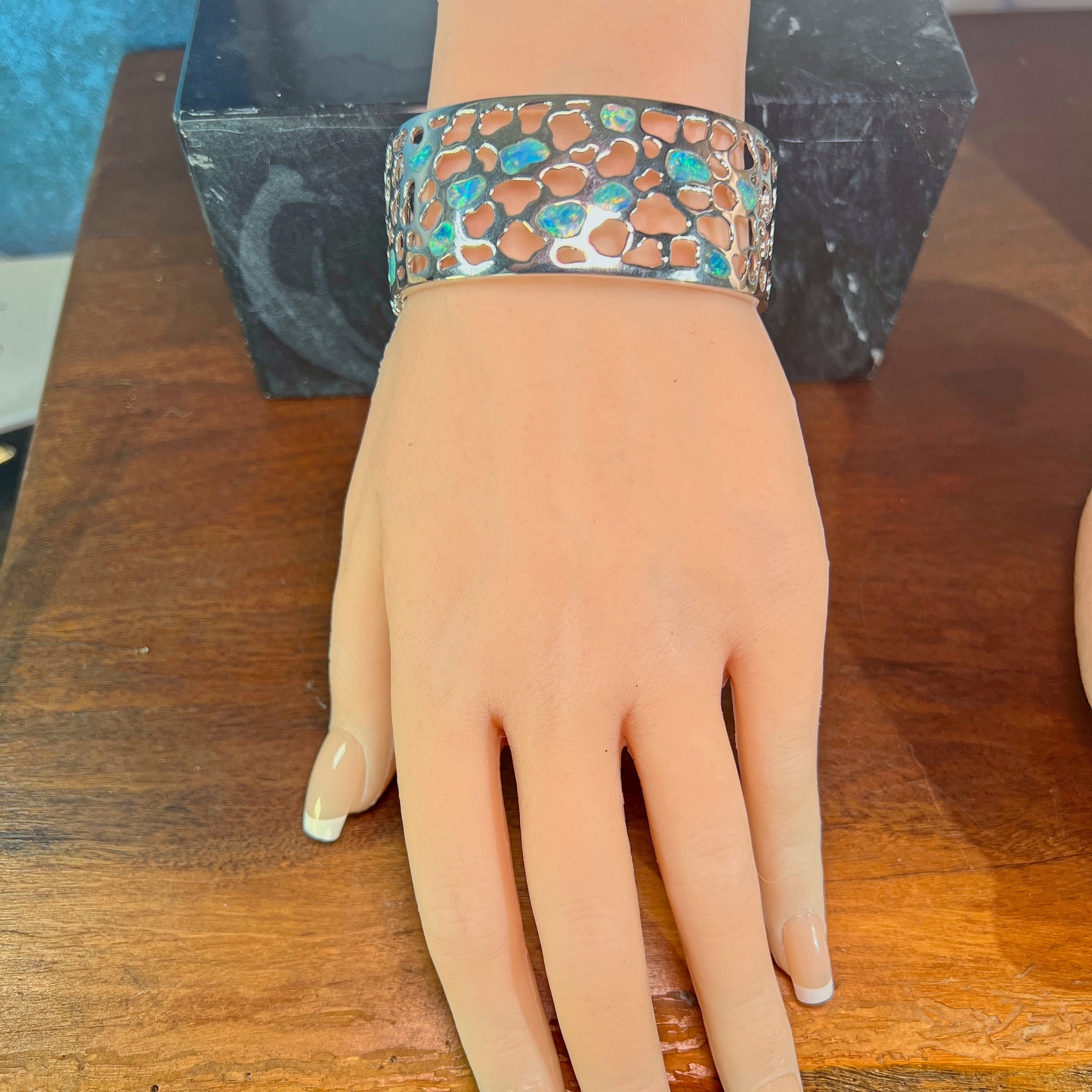 Worn view of the 26mm Australian opal inlay bangle in sterling silver