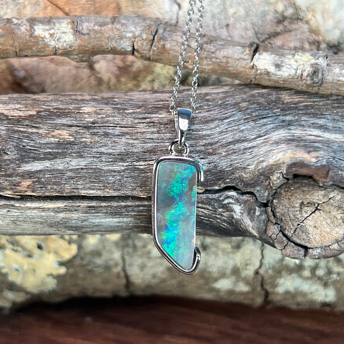18 x 7mm Australian boulder opal pendant in sterling silver, brown, green and blue
