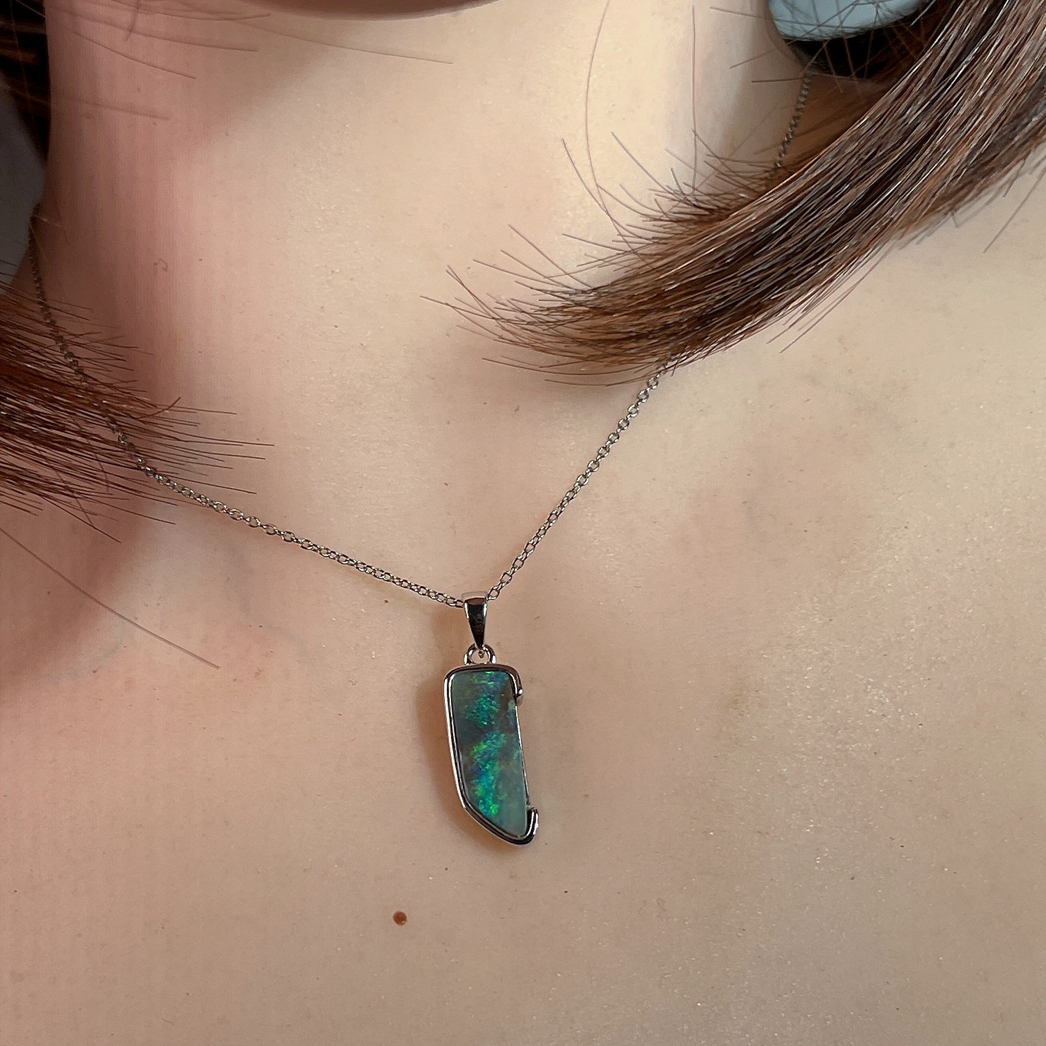 freeform Australian boulder opal pendant in sterling silver, worn at the neck