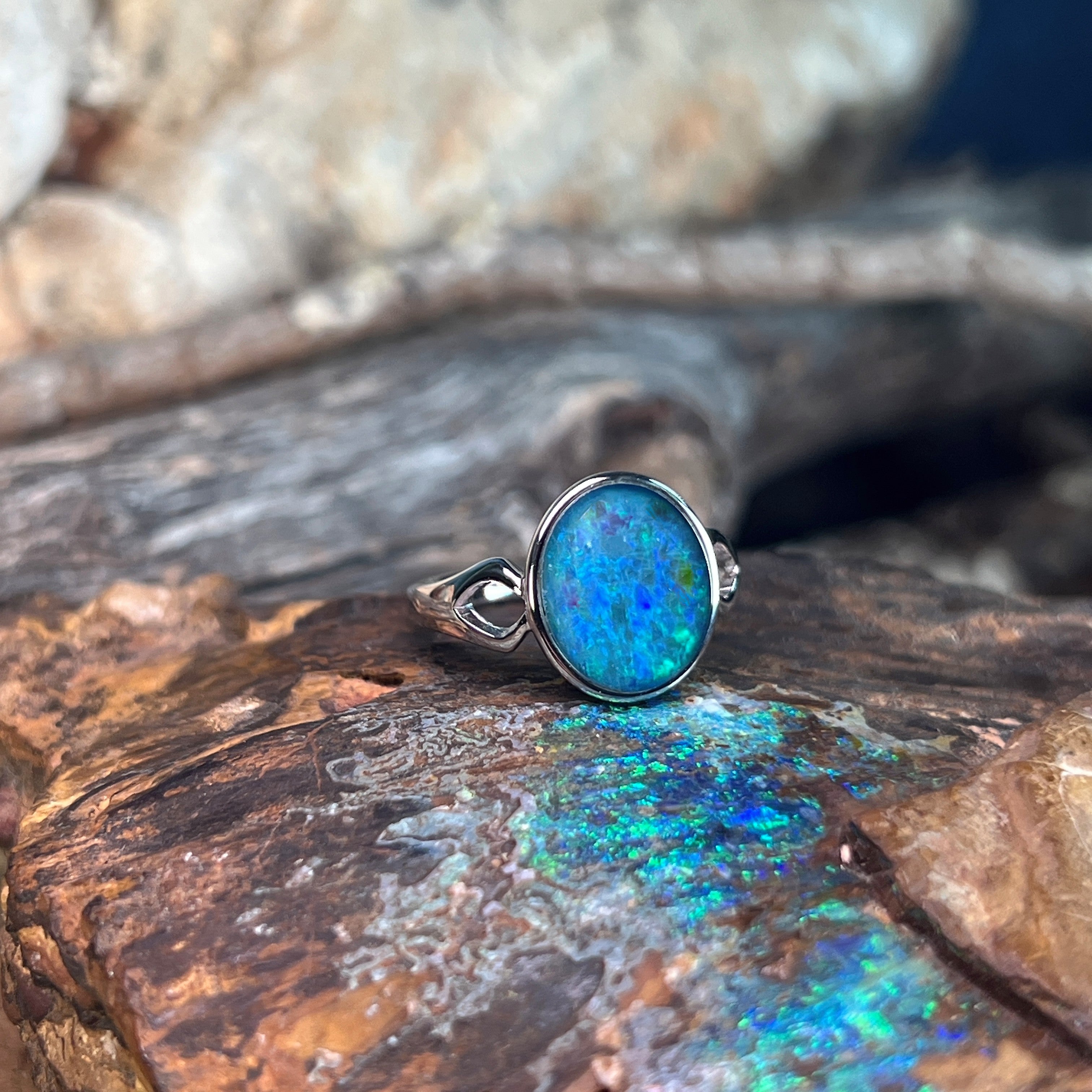 blue and green play-of-colour in a 12 x 10mm oval Australian opal triplet ring