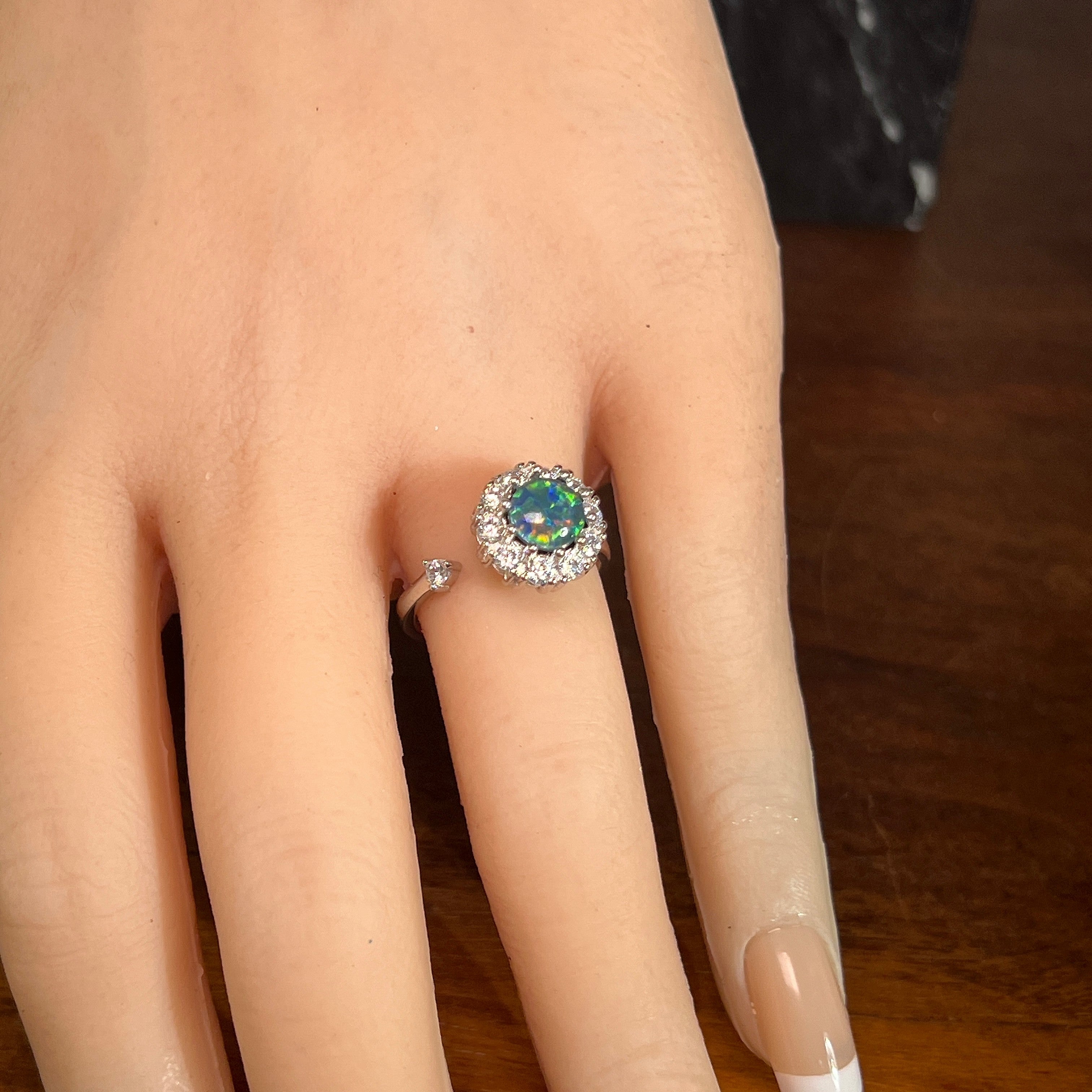 7mm round Australian opal triplet ring on the hand, sterling silver