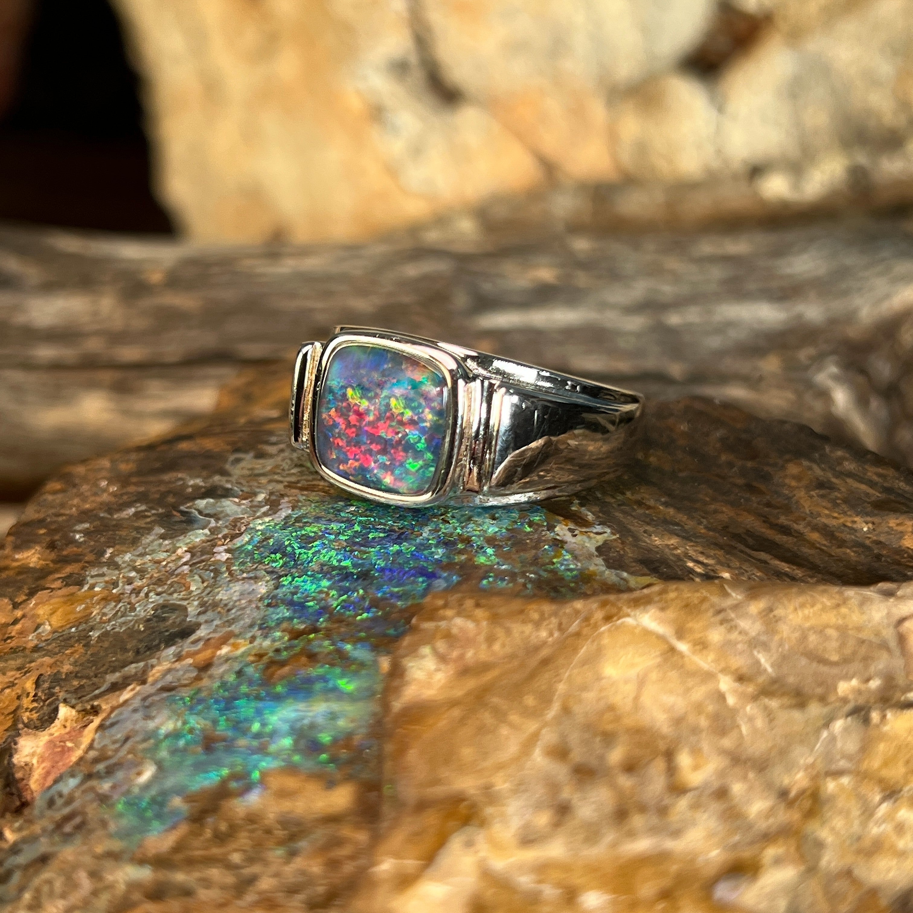 red, blue and green play-of-colour in a 10mm cushion-shaped Australian opal triplet ring