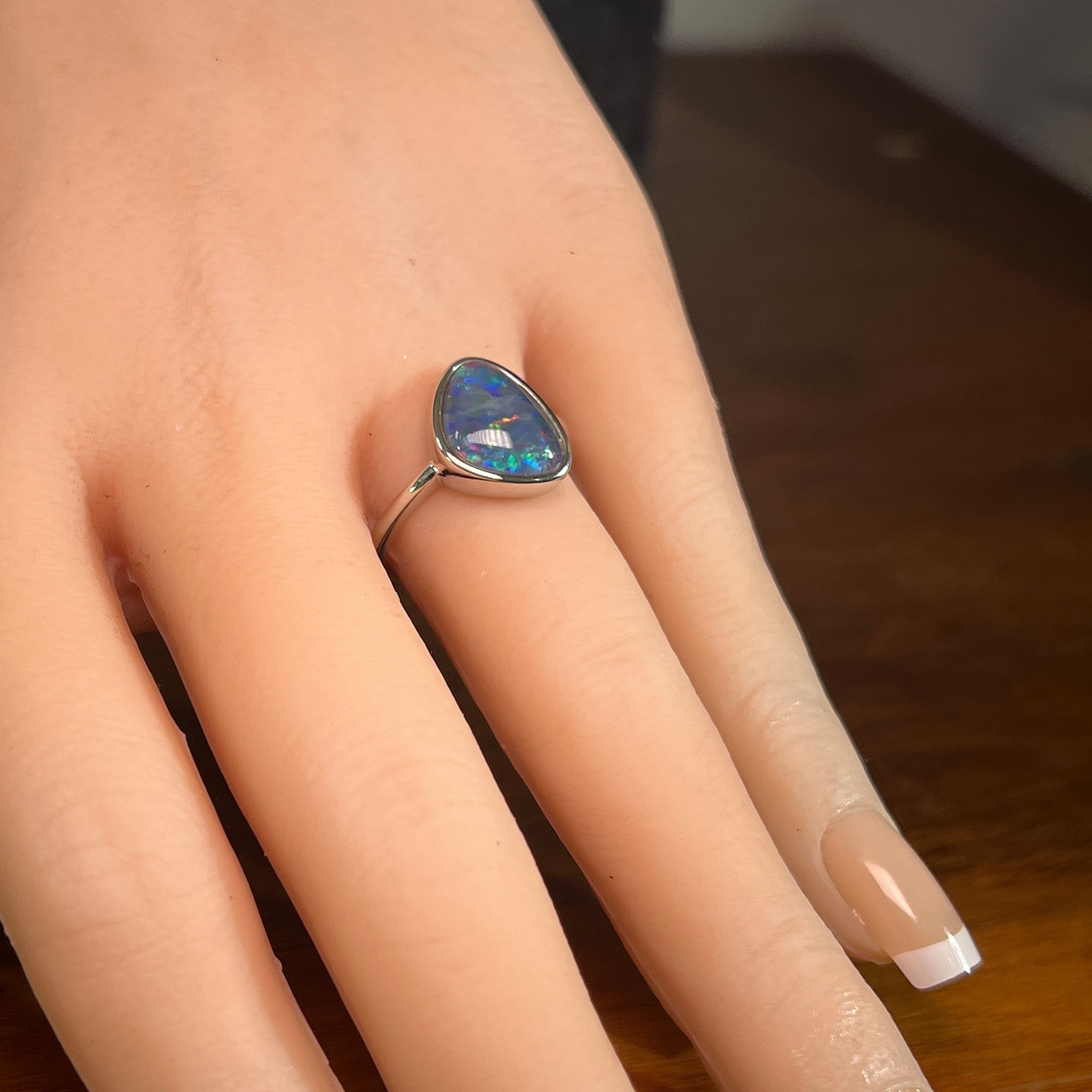 Australian opal triplet ring in sterling silver worn, triangular stone, size US 7.5