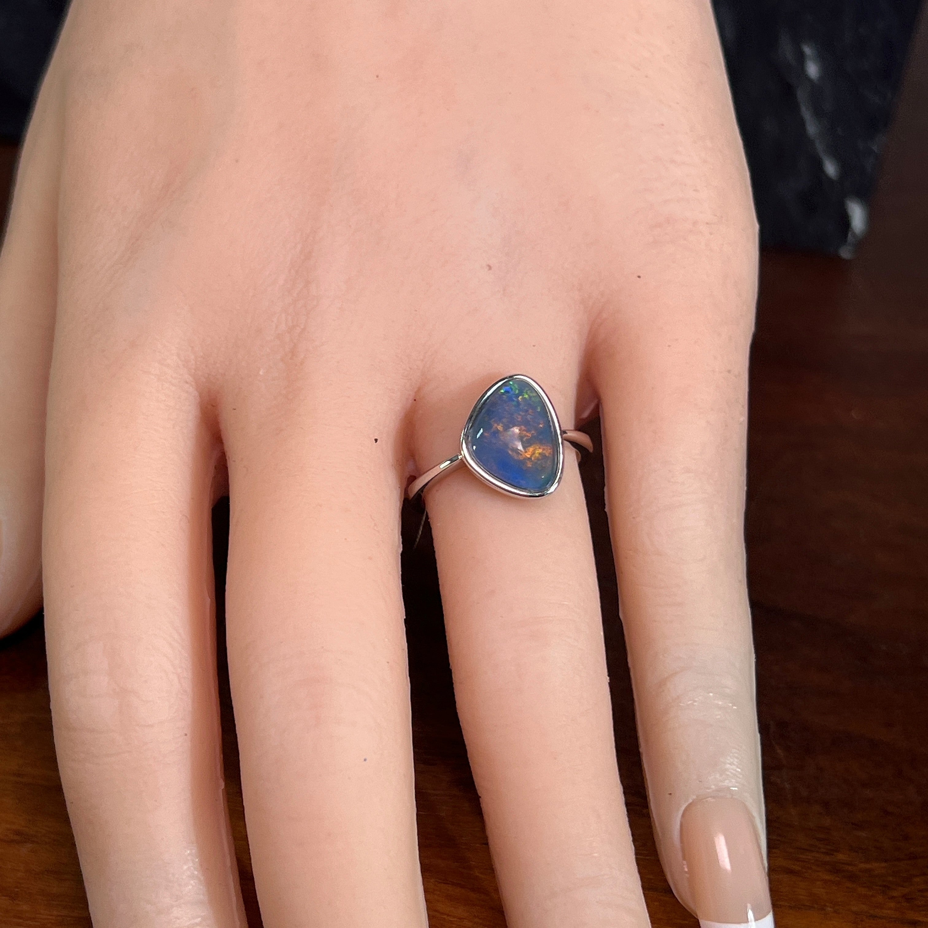 Worn Australian opal triplet ring in sterling silver, yellow, orange, blue and green, 12.5 x 9.5mm