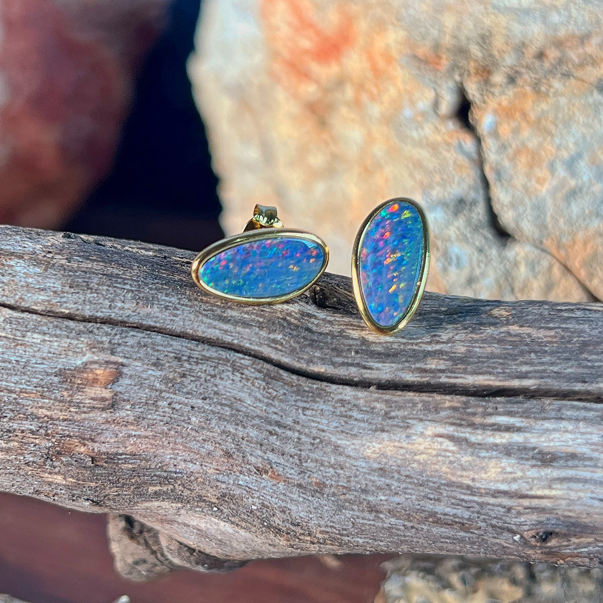 red, blue and green play-of-colour in 12 x 6mm freeform Australian opal doublet earrings