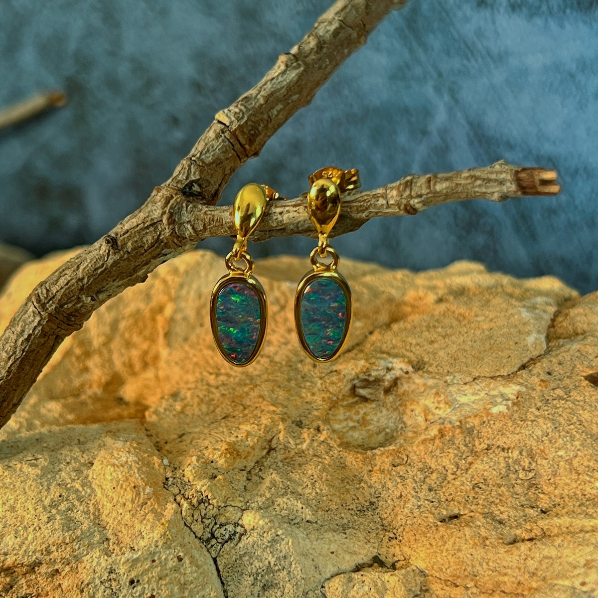 red, pink, blue and green play-of-colour in 11 x 6mm pear-shaped Australian opal doublet earrings