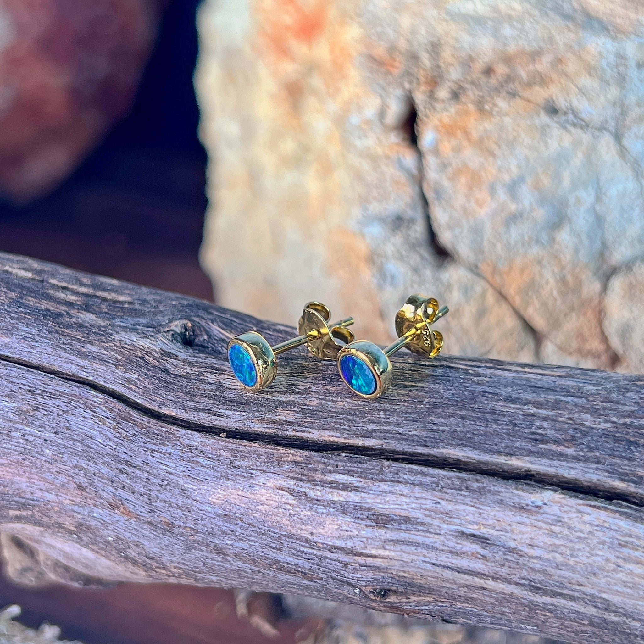 blue and green play-of-colour in 5mm round Australian opal doublet earrings