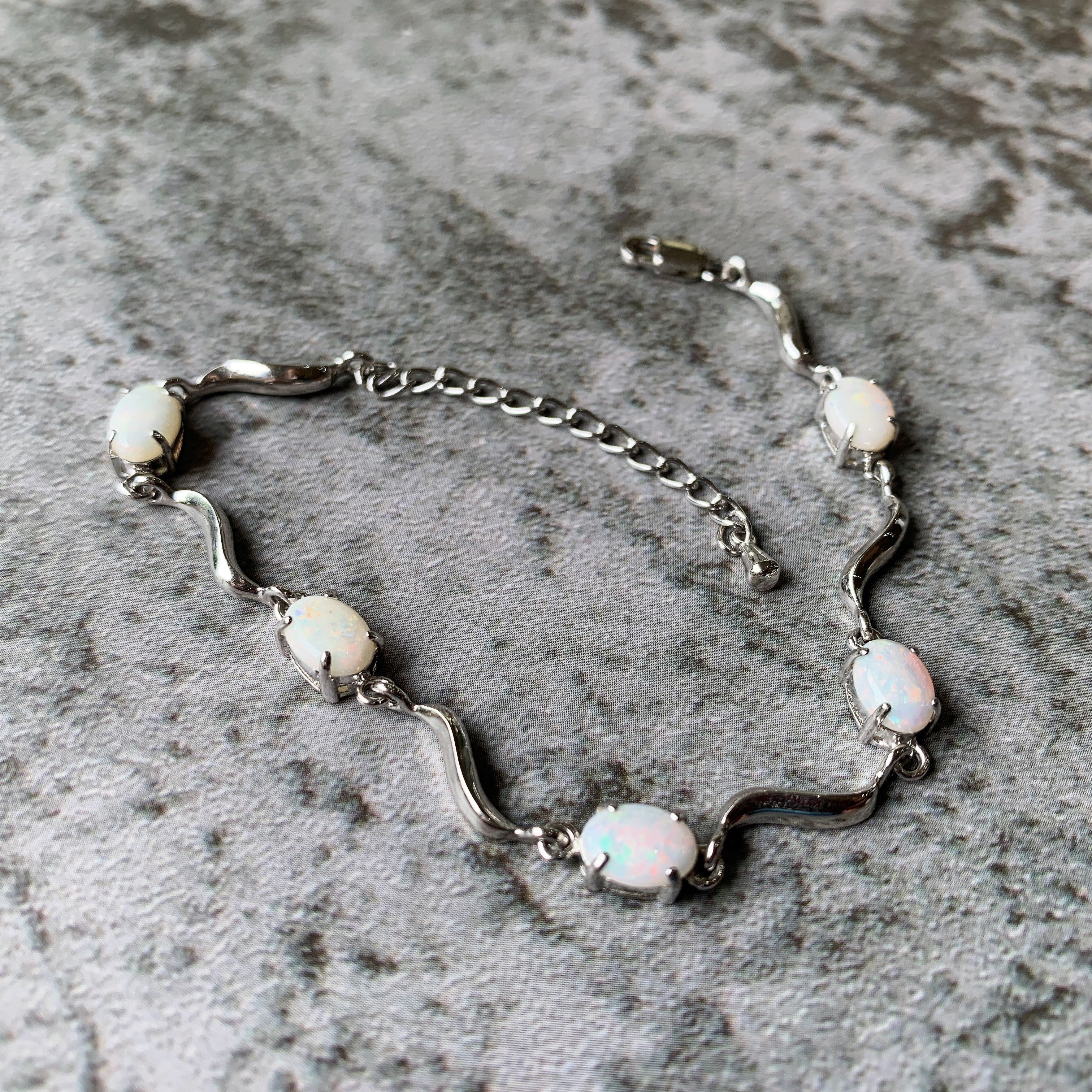 Sterling Silver wave 8x6mm Oval White Opal bracelet - Masterpiece Jewellery Opal & Gems Sydney Australia | Online Shop