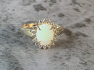 Gold Plated Silver 9x7mm White Opal and cubic zirconia Halo ring