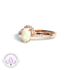 14kt Rose Gold pear shape Opal and diamond ring