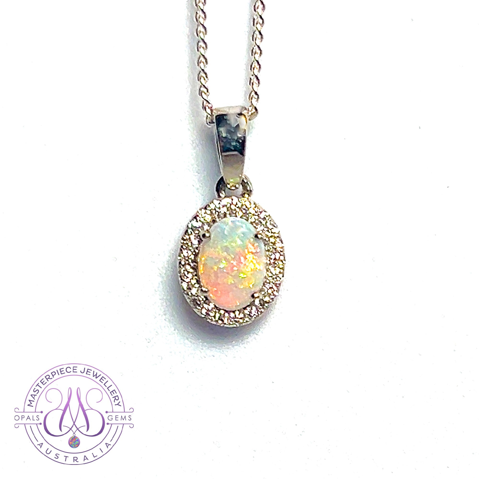 Platinum cluster pendant with one 7x5mm Crystal Opal and Diamond halo