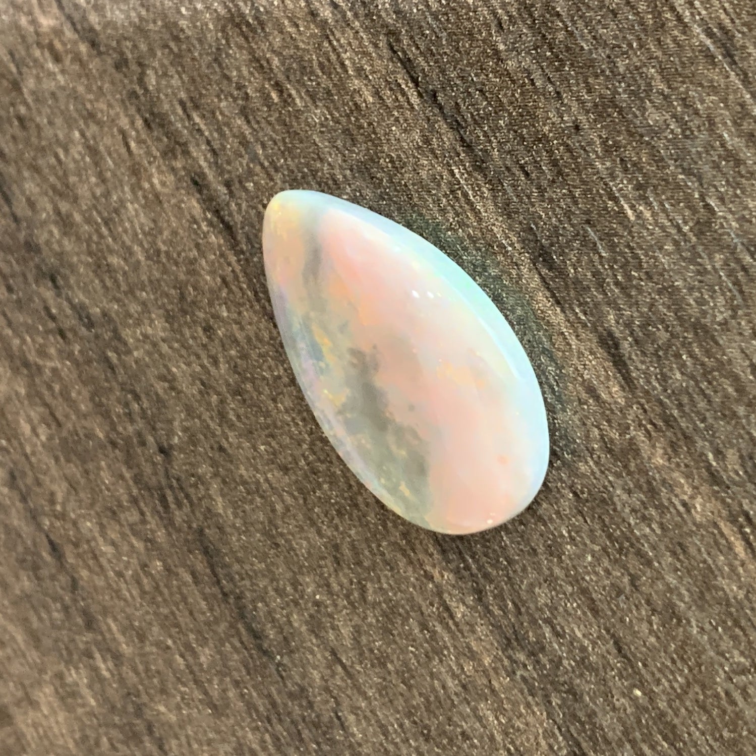 Pearshape Black Opal with red colour 7.08ct