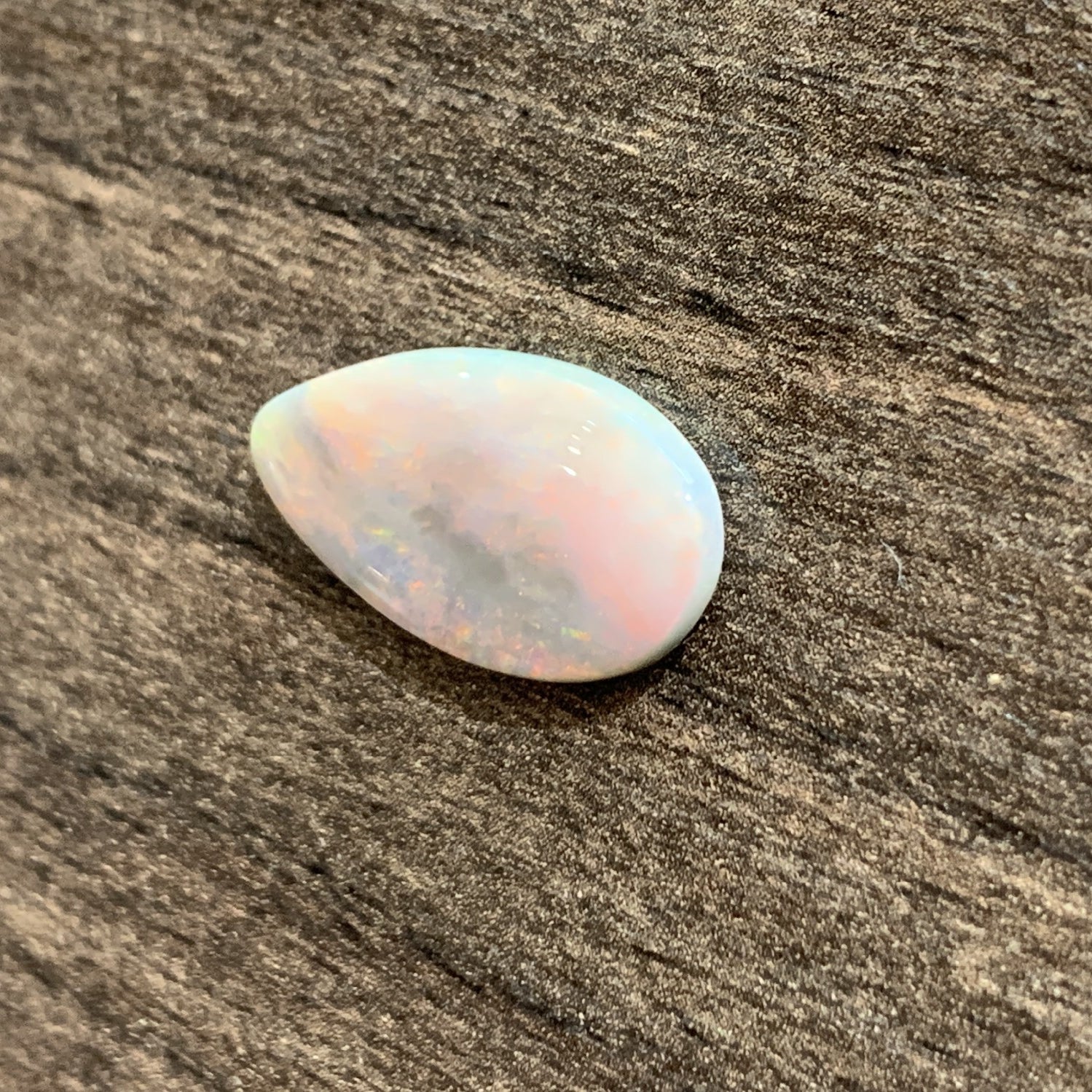 Pearshape Black Opal with red colour 7.08ct