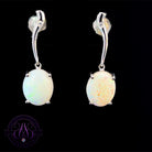 Sterling Silver dangling 10x8mm White Opal claw set curve bar earrings