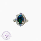 Platinum cluster design ring set with one Black Opal , Tanzanites and diamonds
