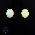 9kt Yellow Gold Oval  10x8mm Light Opal bezel set 2ct earrings