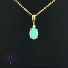 14kt Yellow Gold 8x6mm Crystal Opal and diamond pendant