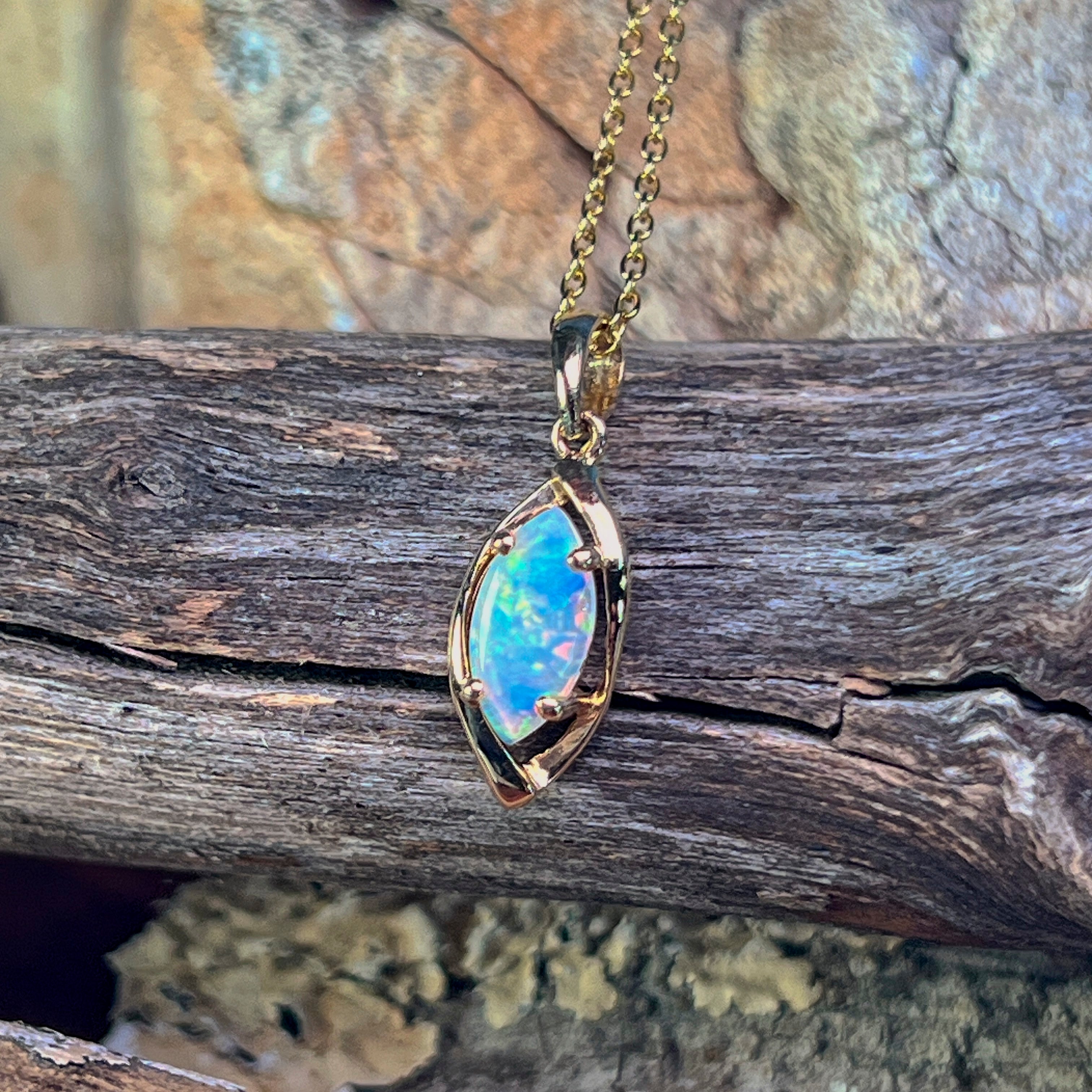 0.5ct Australian crystal opal in a marquise 9kt yellow gold frame