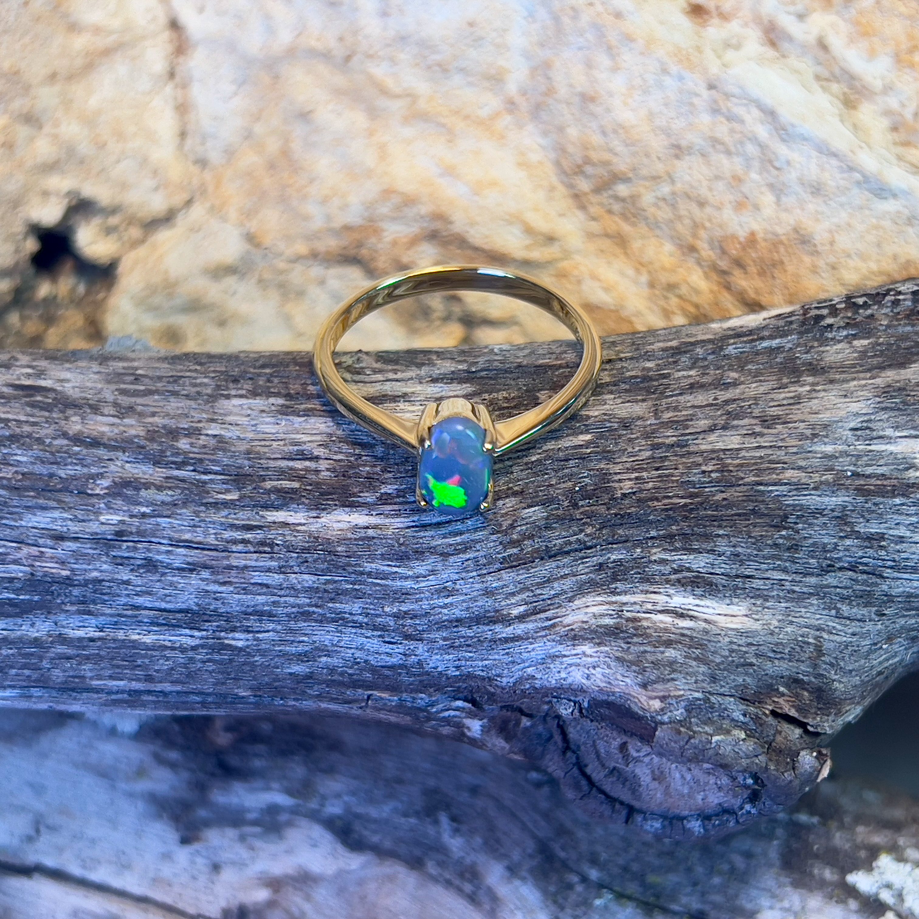 18kt Yellow Gold solitaire ring set with one 0.65ct Black Opal - Masterpiece Jewellery Opal & Gems Sydney Australia | Online Shop