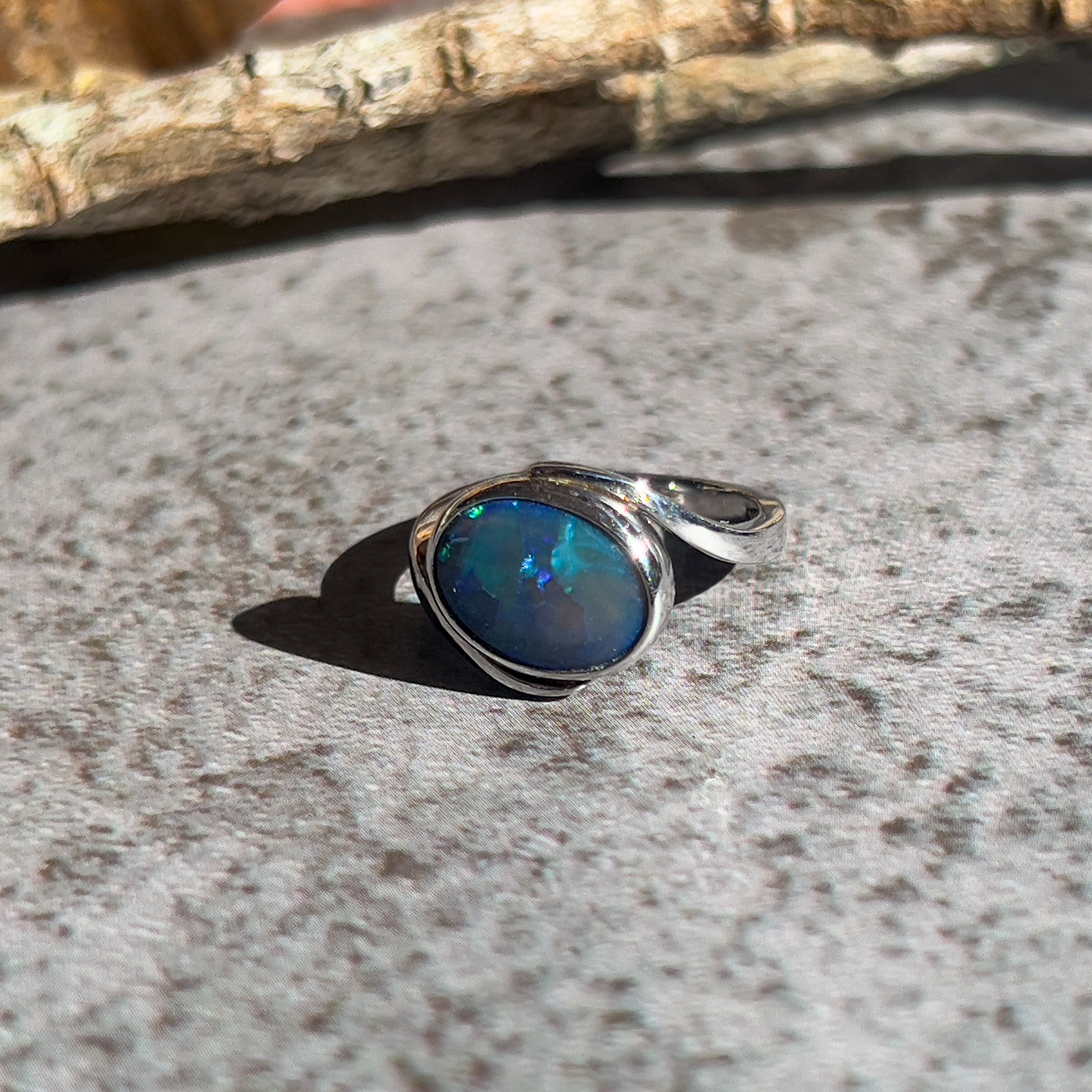 18kt White Gold cross over Black Opal 1.5ct Blue Green solitaire ring - Masterpiece Jewellery Opal & Gems Sydney Australia | Online Shop