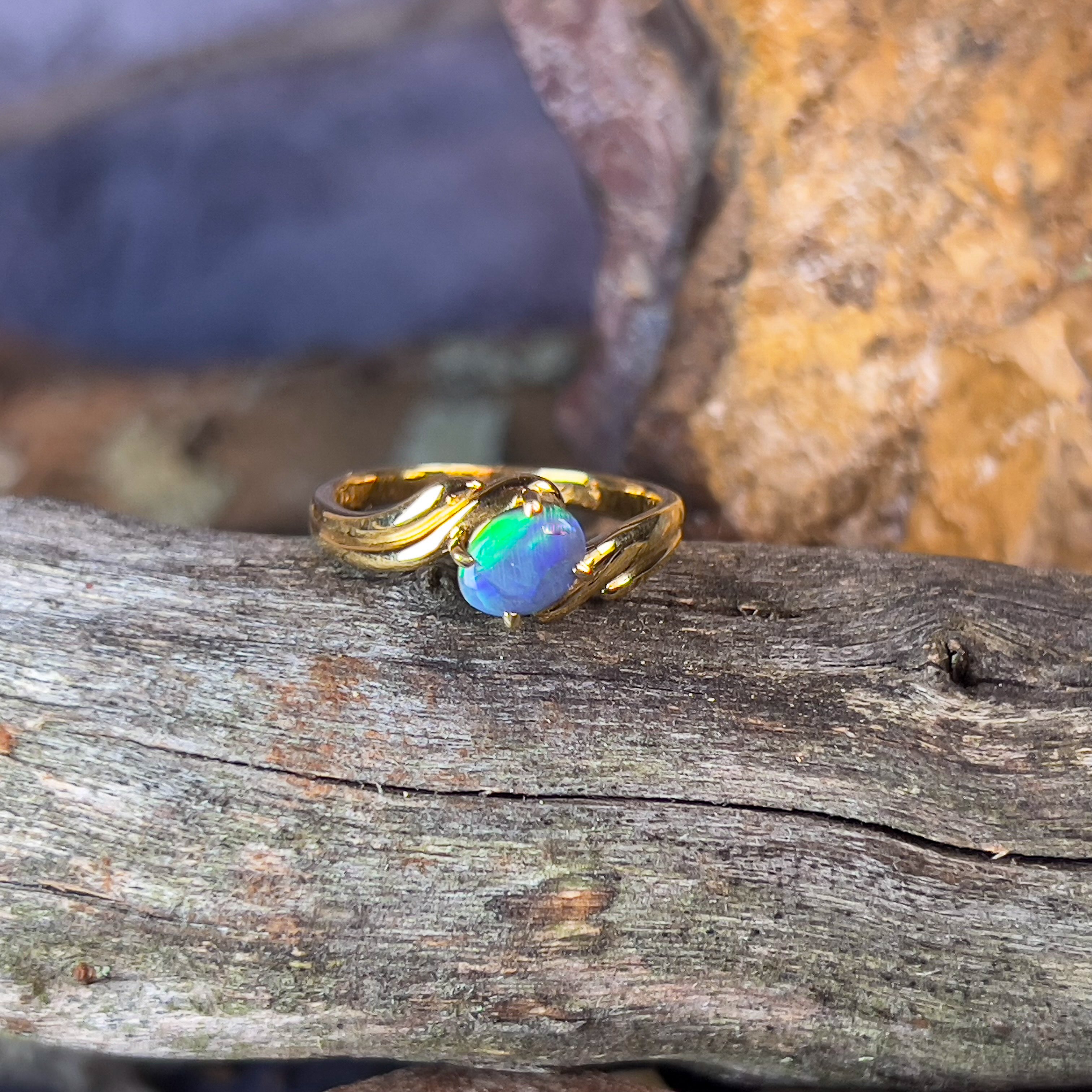 18kt Yellow Gold ring cross over 0.6ct Black Opal - Masterpiece Jewellery Opal & Gems Sydney Australia | Online Shop