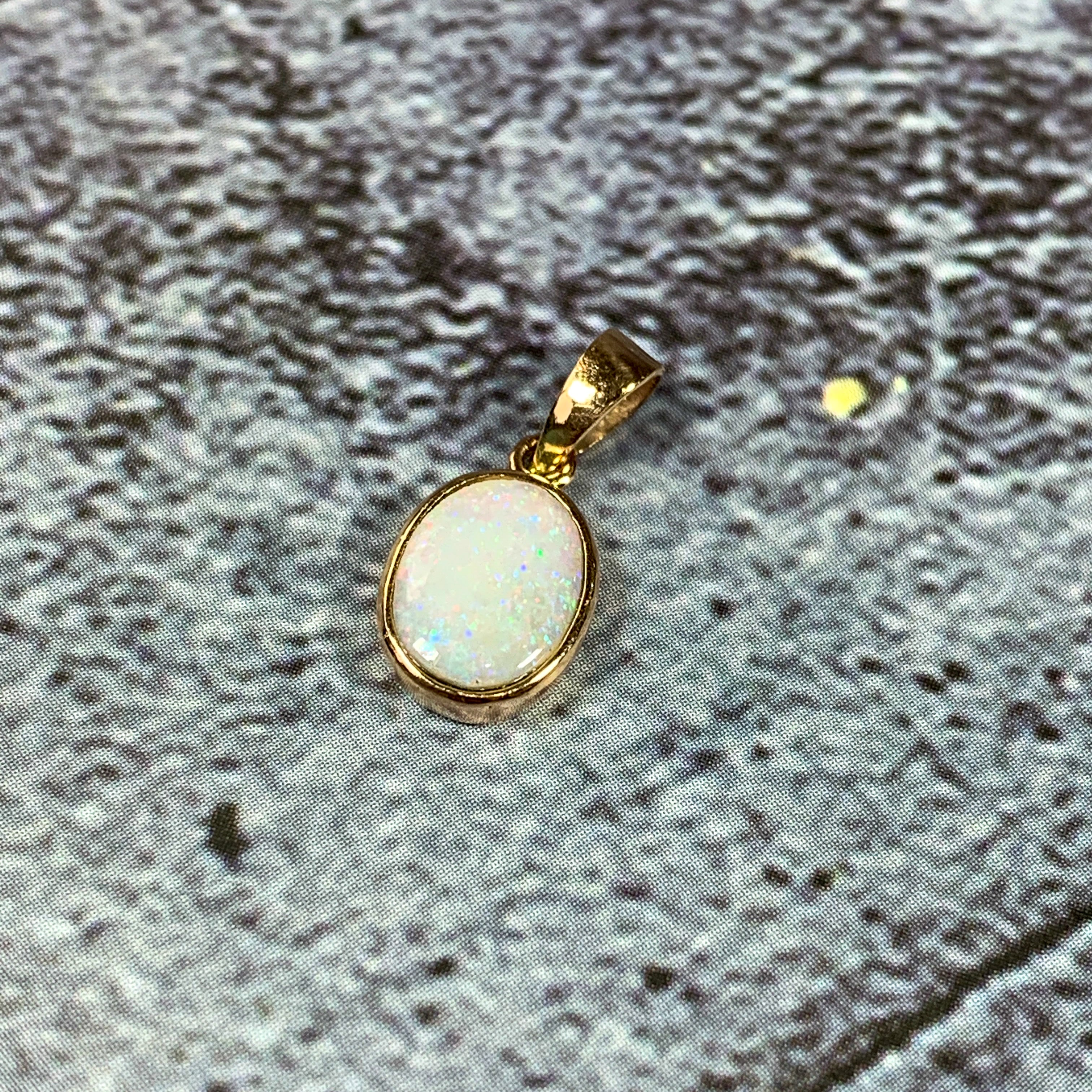 9kt Yellow Gold pendant bezel set with one 8x6mm White Opal - Masterpiece Jewellery Opal & Gems Sydney Australia | Online Shop