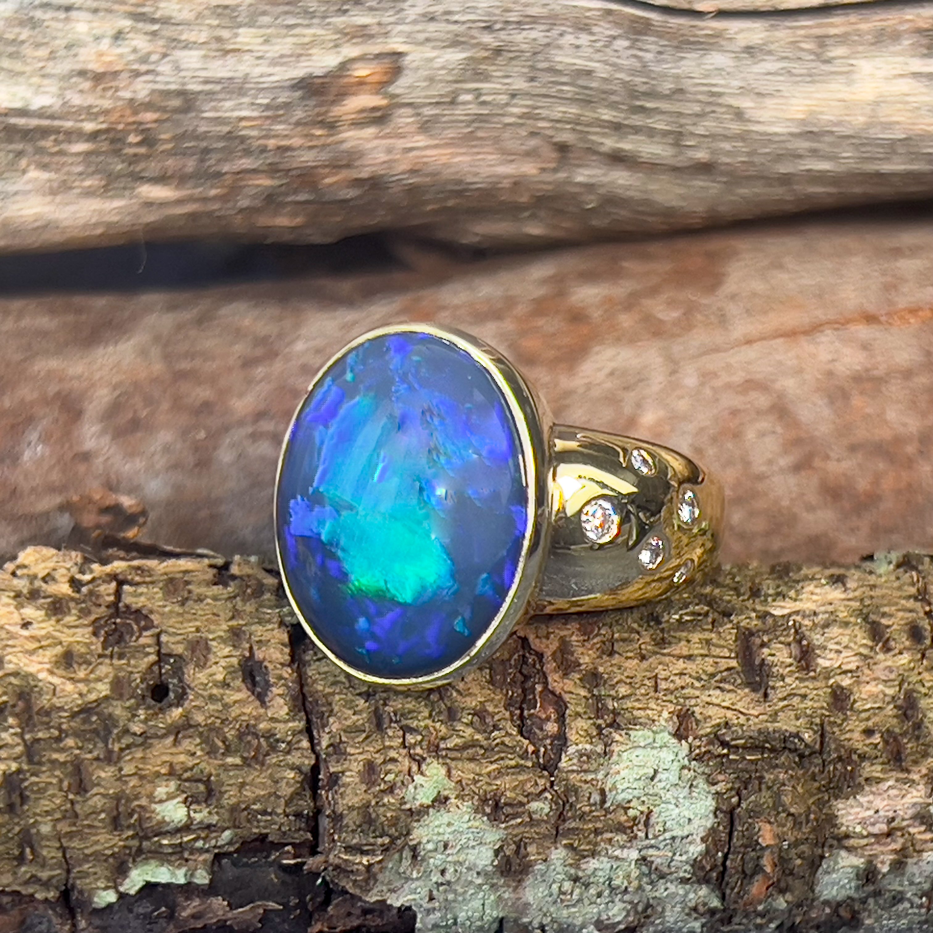 18kt Yellow Gold bezel set band Black Opal 6.05ct and diamonds flush set ring - Masterpiece Jewellery Opal & Gems Sydney Australia | Online Shop