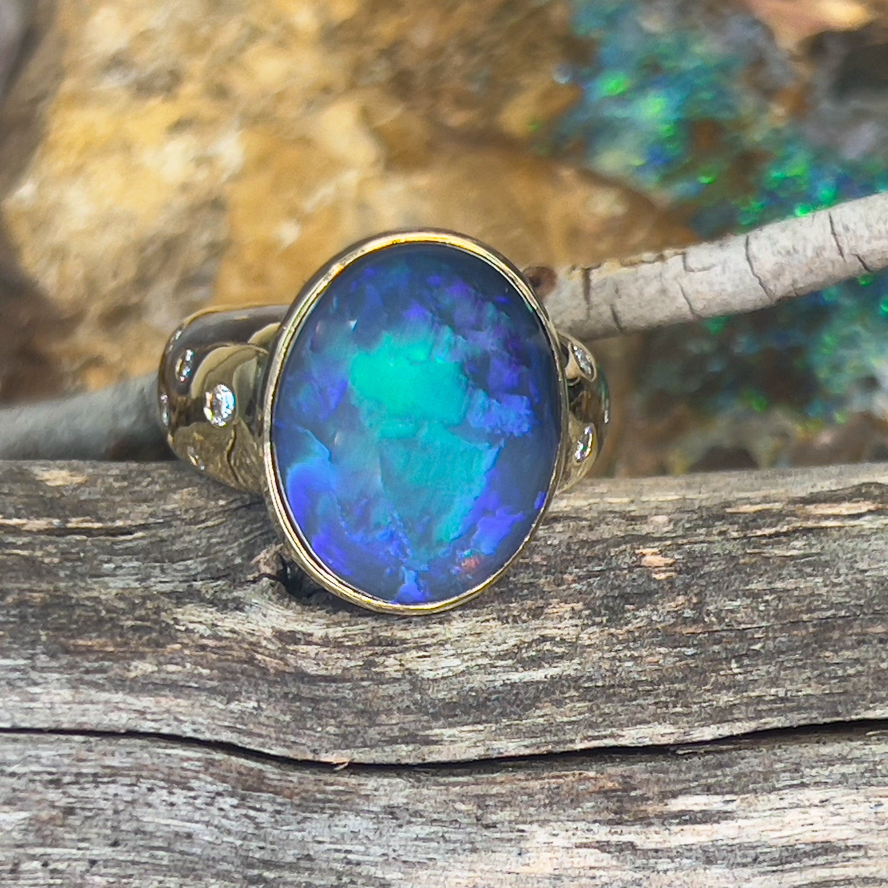 18kt Yellow Gold bezel set band Black Opal 6.05ct and diamonds flush set ring - Masterpiece Jewellery Opal & Gems Sydney Australia | Online Shop