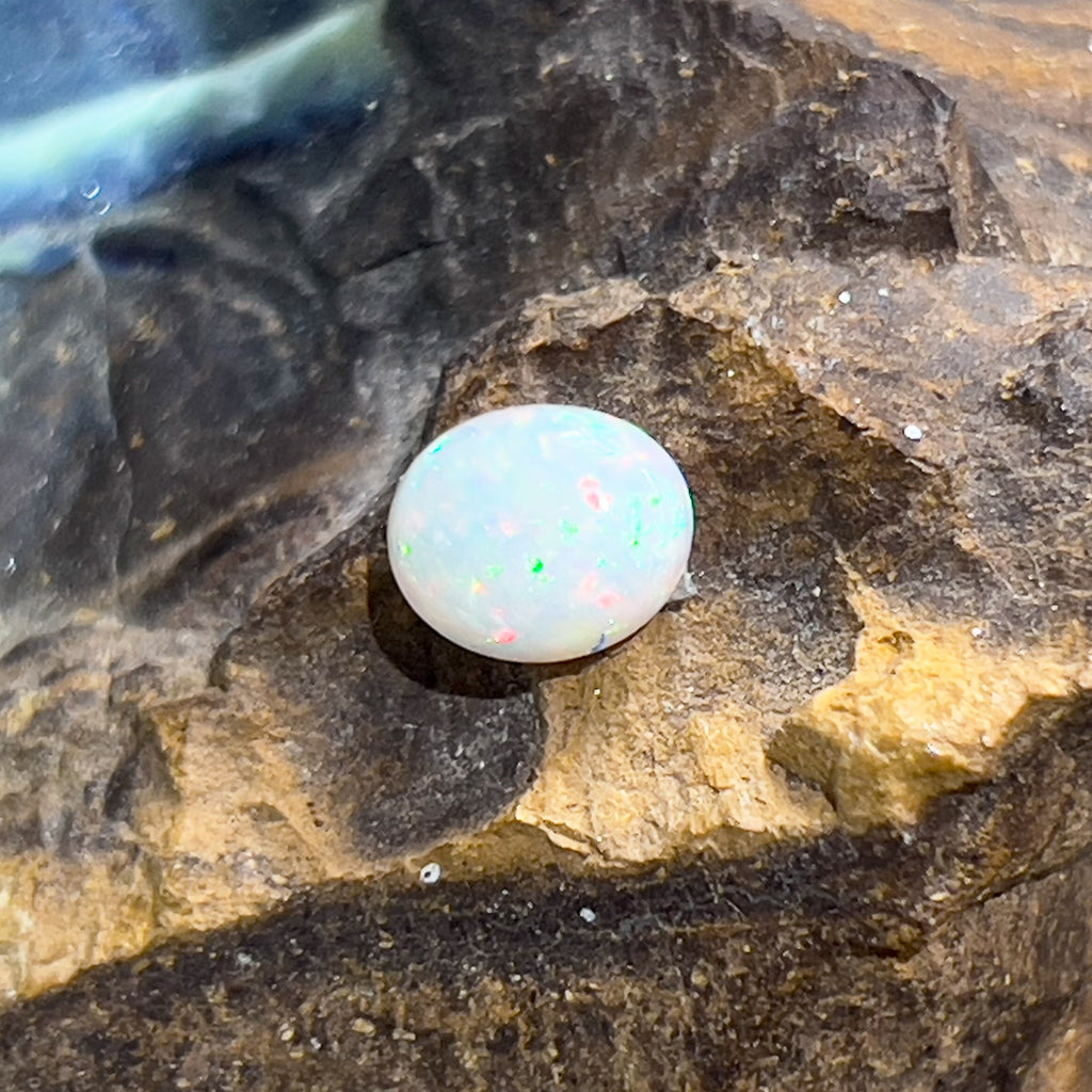 One 0.85ct White Opal with Red Green pinfire - Masterpiece Jewellery Opal & Gems Sydney Australia | Online Shop