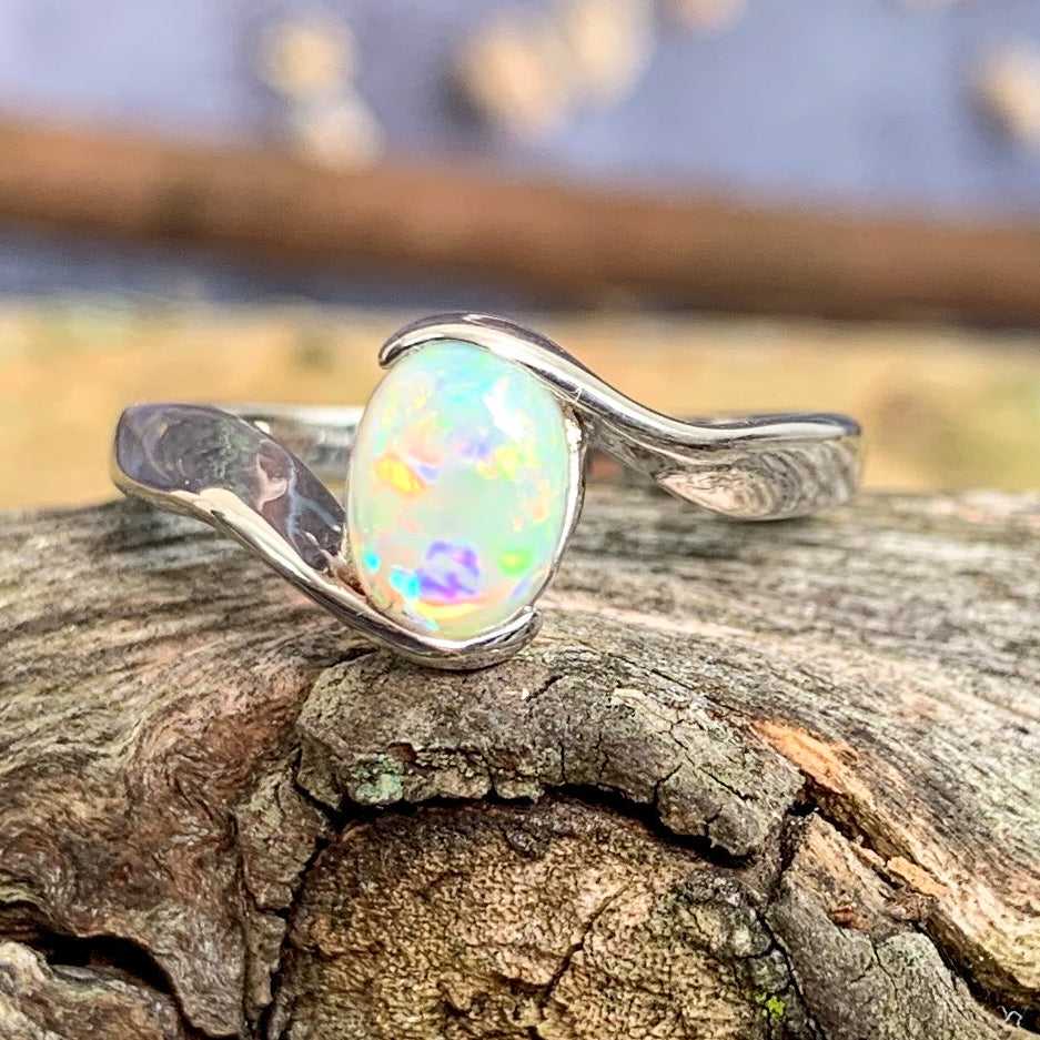 14kt White Gold solitaire cross over ring with 0.7ct Semi Black Opal - Masterpiece Jewellery Opal & Gems Sydney Australia | Online Shop
