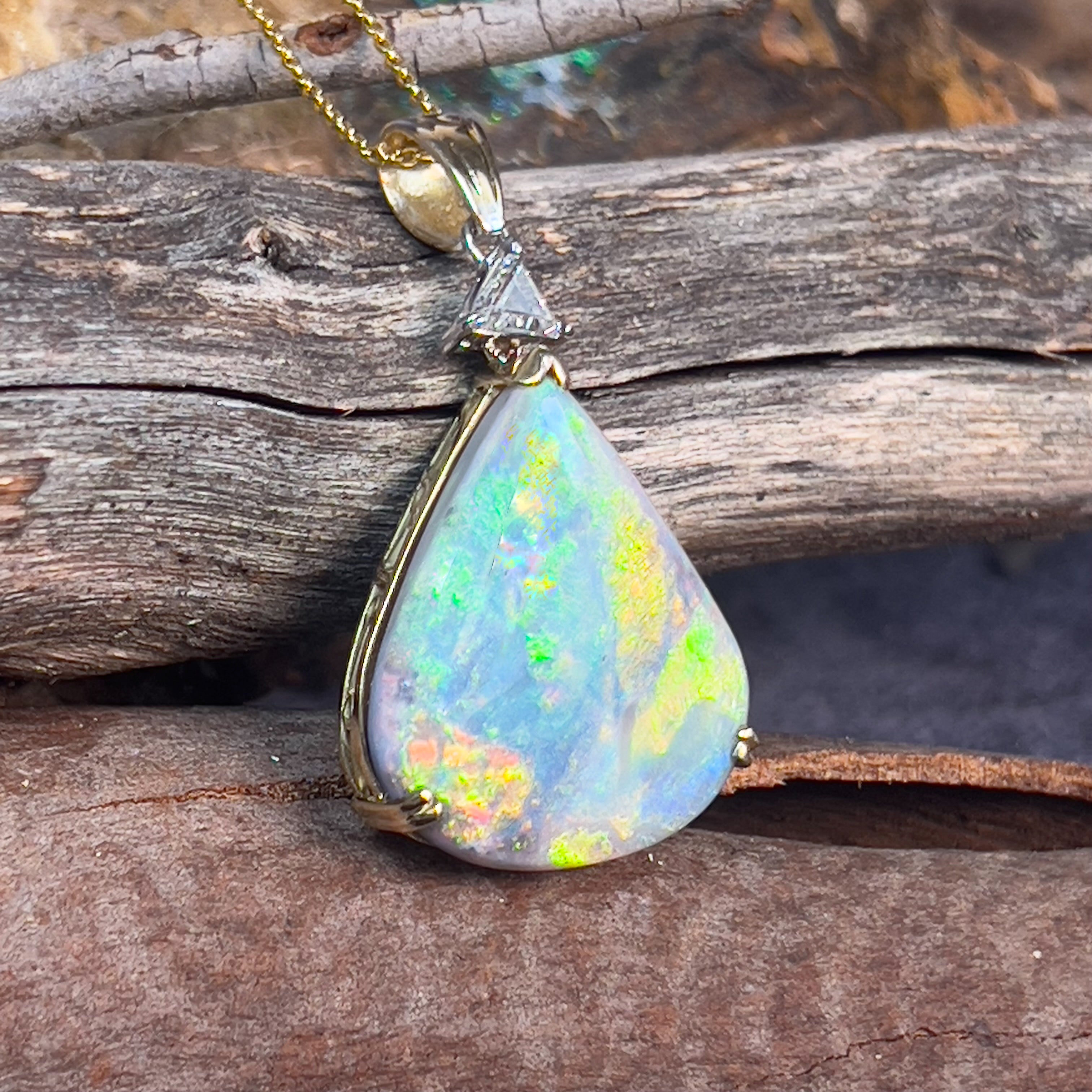 18kt Yellow Gold Pear shape Black Opal 20.05ct and Trillion cut diamond pendant - Masterpiece Jewellery Opal & Gems Sydney Australia | Online Shop