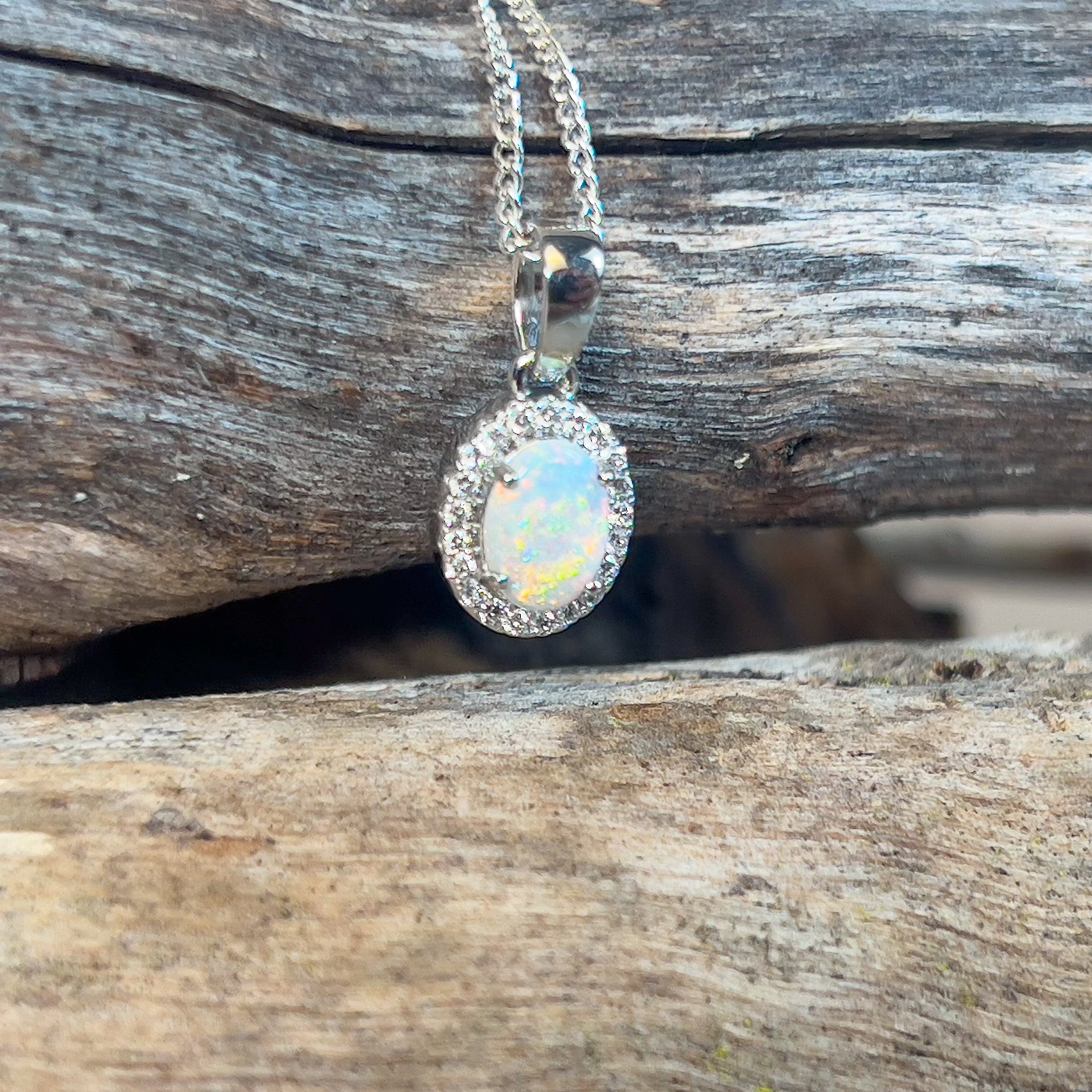 Platinum cluster pendant with one 7x5mm Crystal Opal and Diamond halo - Masterpiece Jewellery Opal & Gems Sydney Australia | Online Shop