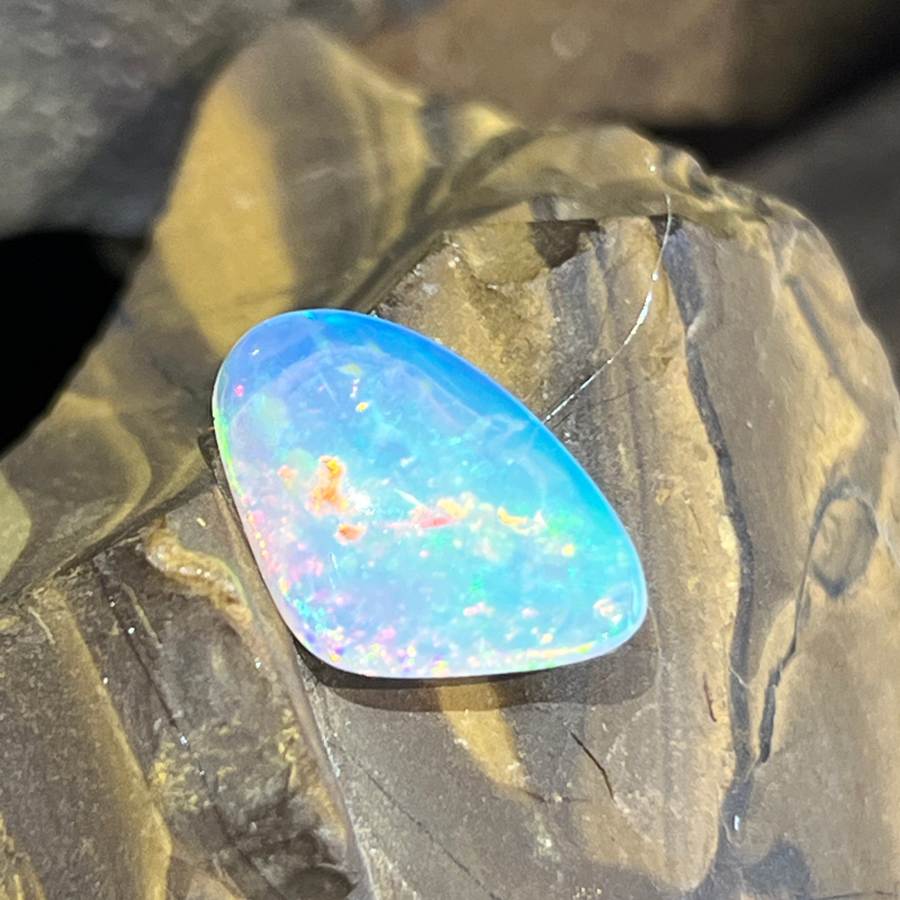 15.5x9.4mm Australian crystal opal, blue and green play of colour with pink and orange flecks