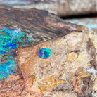 0.65ct Australian opal doublet on ironstone, bright green flaring from a blue body