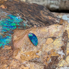 0.88ct Australian opal doublet on ironstone, green and blue along an elongated freeform
