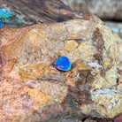 Freeform 0.70ct Australian opal doublet showing deep blue against pale ironstone
