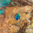 0.82ct pear shape Australian opal doublet on ironstone, green flaring over blue