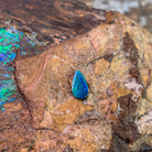 Pear shape Australian opal doublet, 0.82ct, blue and green fire against weathered rock