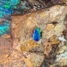 Blue violet body with green play-of-colour, a 0.82ct pear shape Australian opal doublet