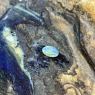 Australian crystal opal 1.00ct oval cabochon, 9x6.8mm, red, orange and green flashes, loose and unset, on rock