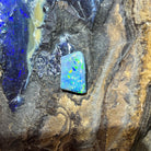 Loose solid black opal 5.15ct, rectangular, yellow, orange, green and blue pinfire, ready for a custom setting, on rock