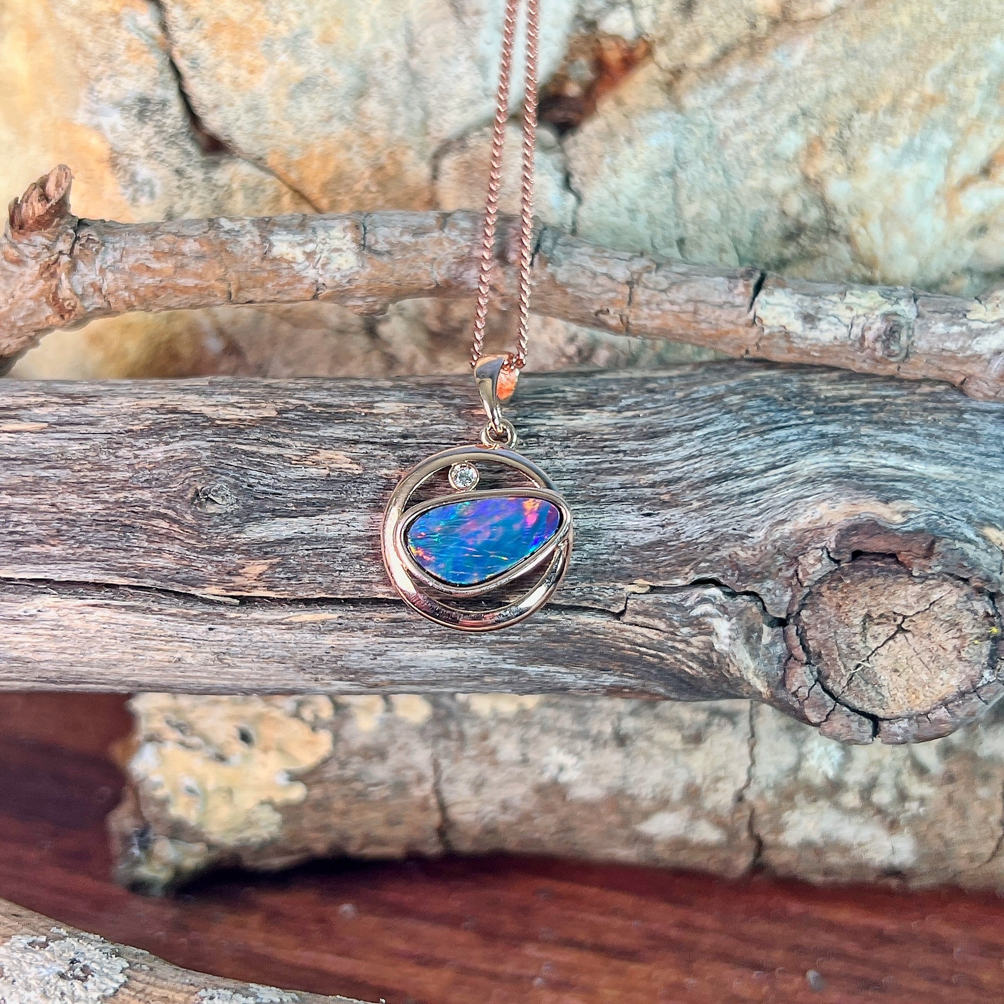 freeform Australian opal doublet pendant in rose gold-plated silver, blue, yellow, green and red play-of-colour