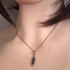 Australian opal doublet pendant worn at the neck, rose gold-plated silver, 15 x 5mm marquise stone
