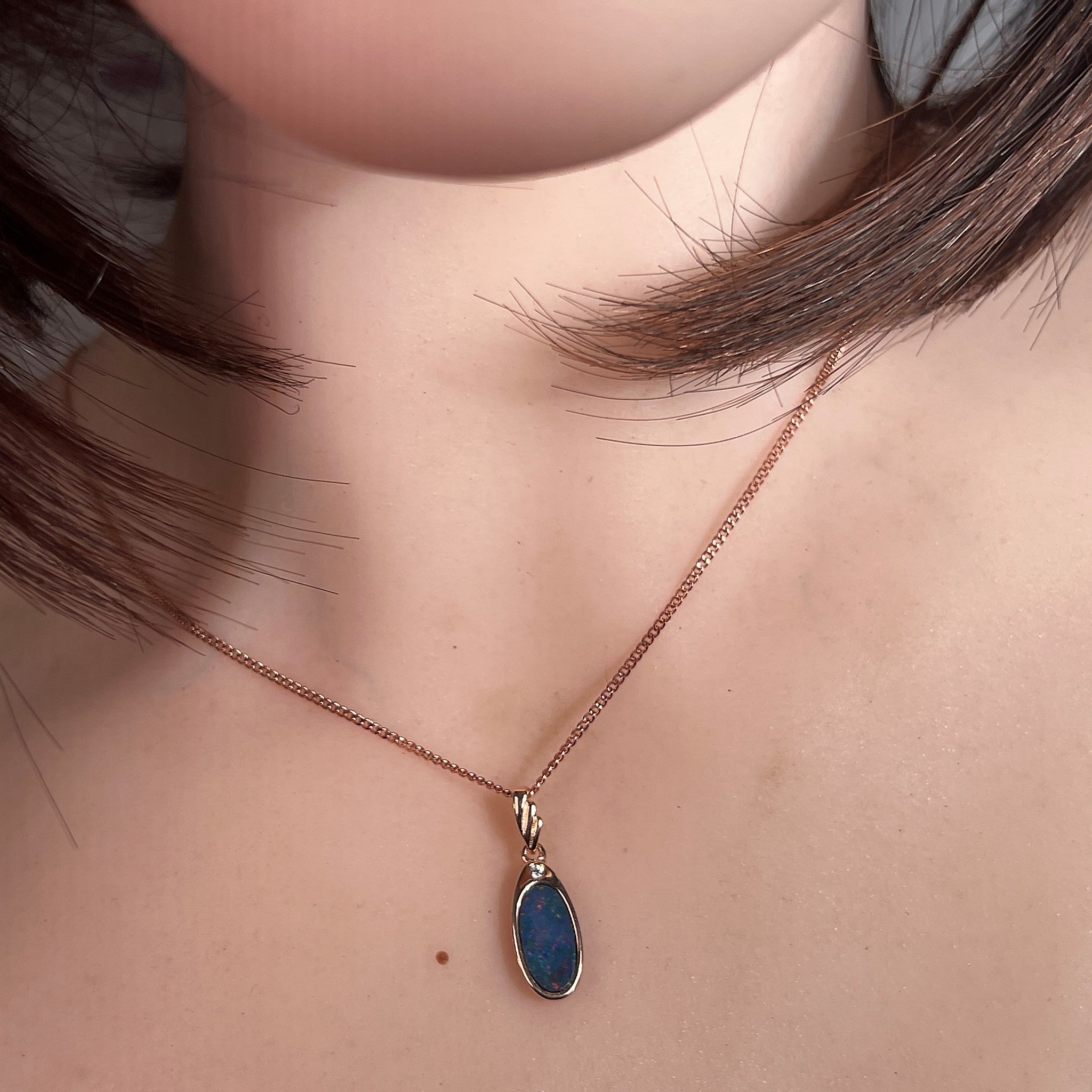 Australian opal doublet pendant worn at the neck, rose gold-plated silver, 12 x 6.5mm oval stone