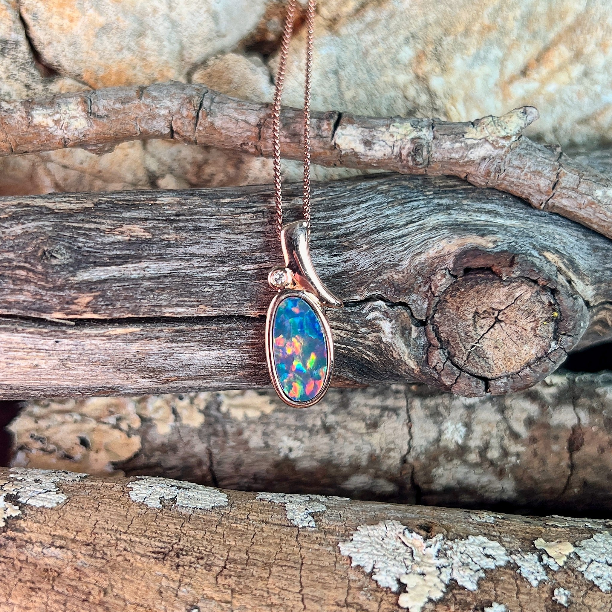 oval Australian opal doublet pendant in rose gold-plated silver, yellow, red, blue and green play-of-colour