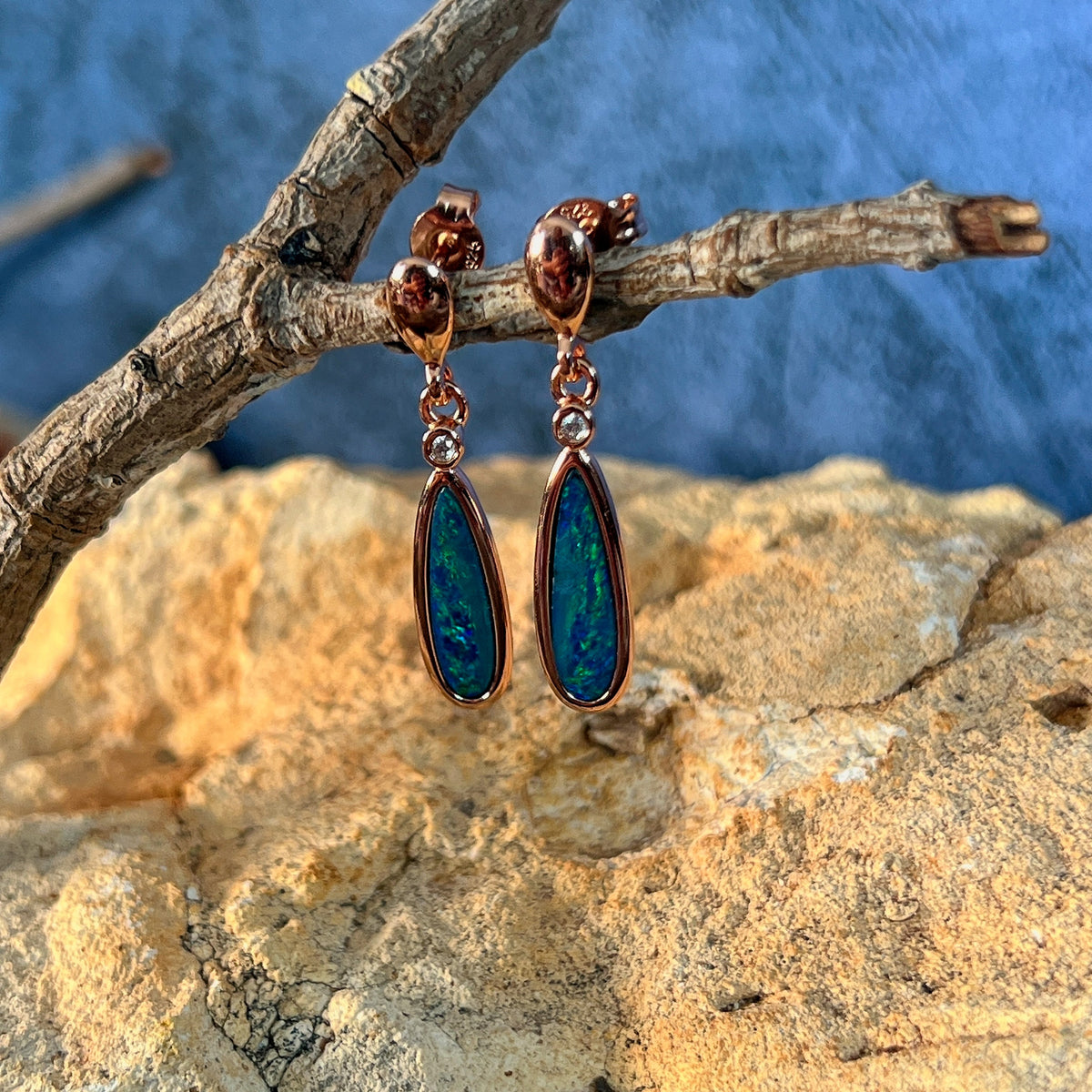 green and blue play-of-colour in 16 x 5mm pear-shaped Australian opal doublet earrings