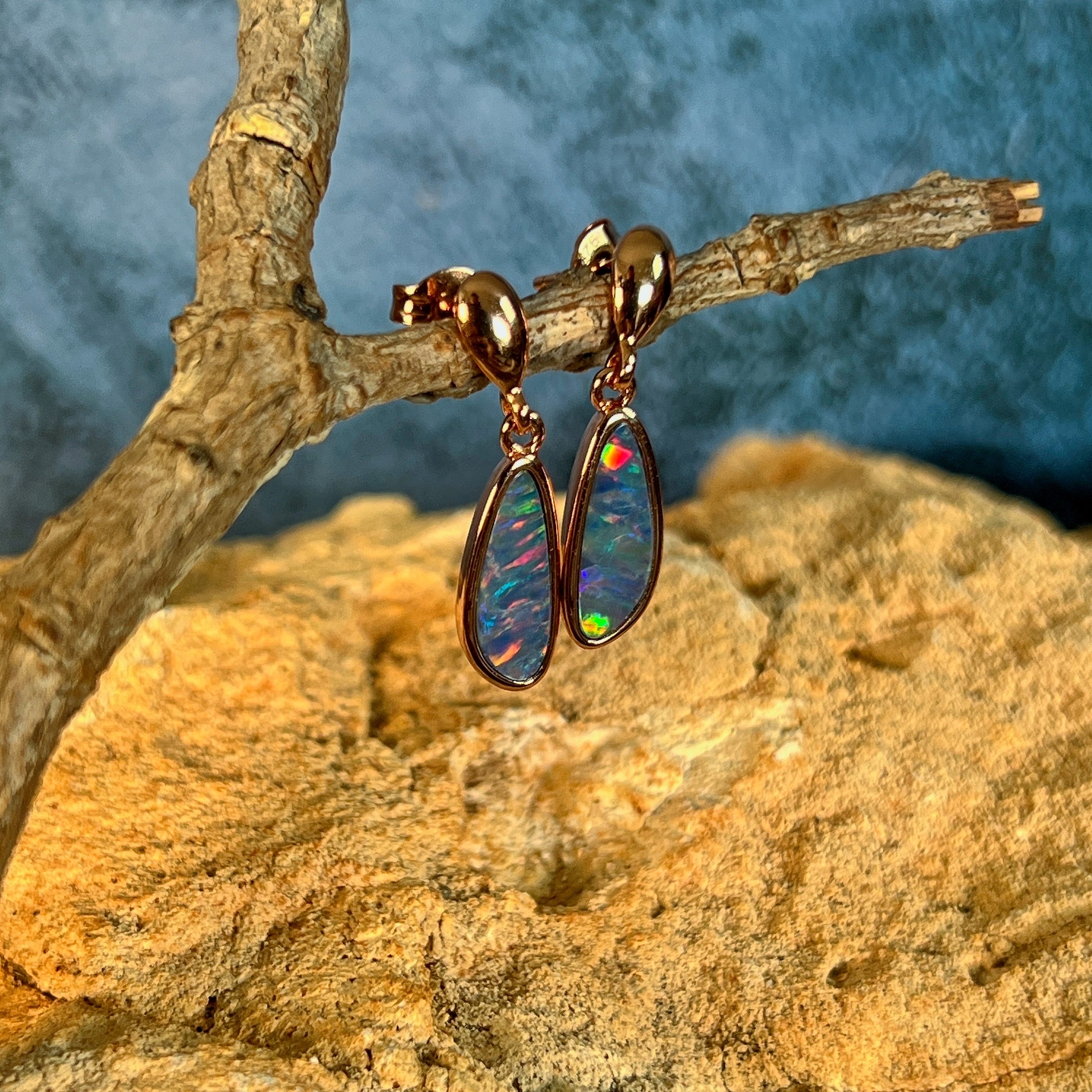 violet, red, green and blue play-of-colour in 13 x 5mm pear-shaped Australian opal doublet earrings